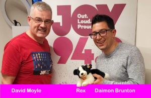 Daimon Brunton holding Rex in the Bent Notes Studio at JOY 94.9 with host David Moyle